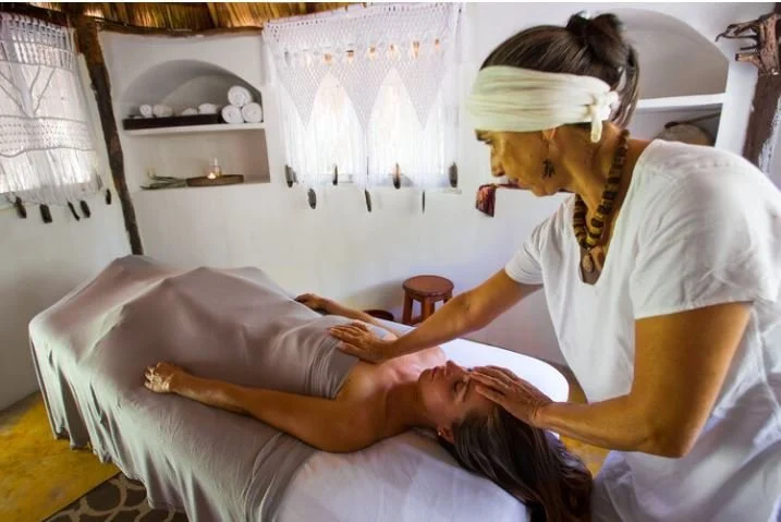 Guest enjoys a massage at amansala all inclusive resort