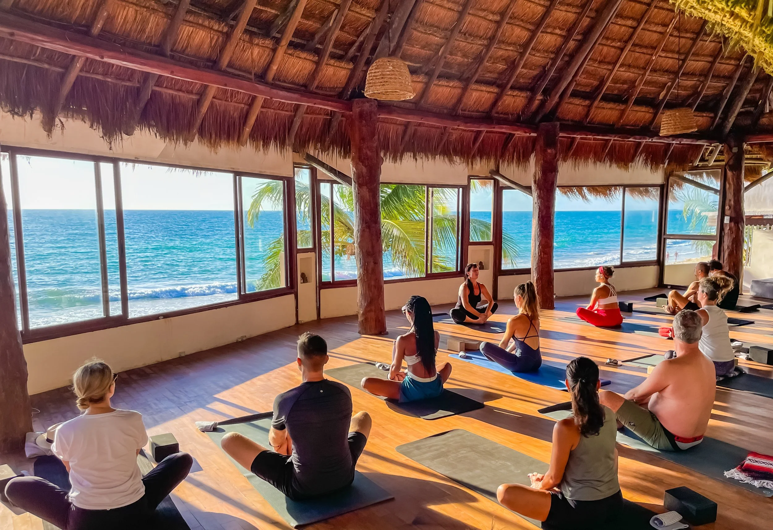 Amansala's Tulum Wellness Retreat class. Yoga class at the Yoga Shala, beachfront Tulum, Mexico.